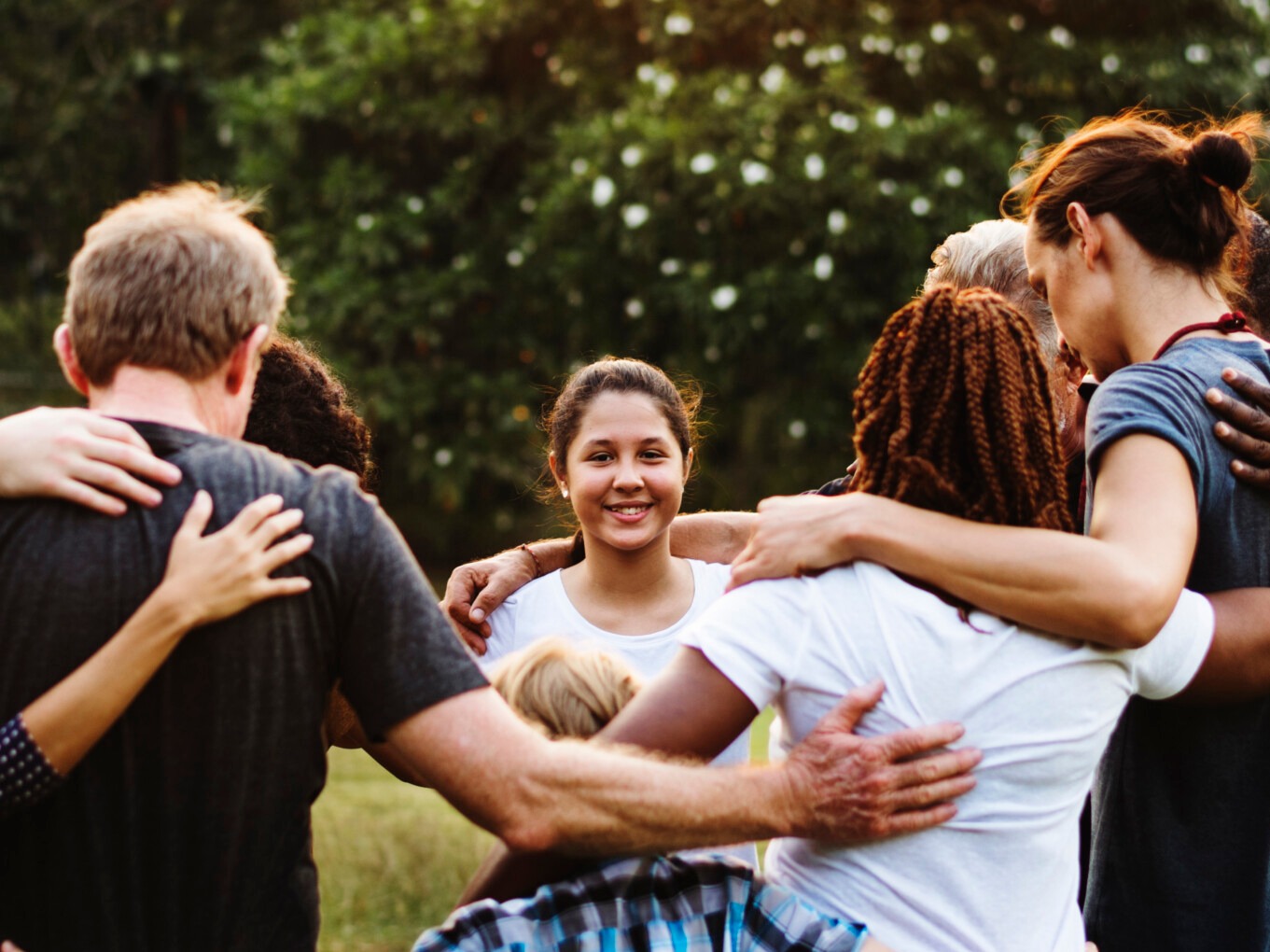 people outdoors holding hands