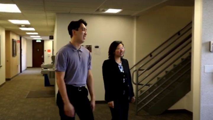 SLHS Student, Chris Nguyen, walking with his mentor Giang Pham