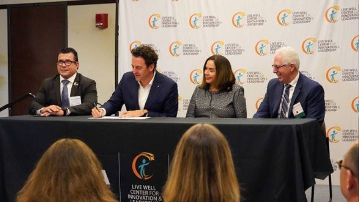 SDSU President Adela de la Torre, joined by Nick Macchione, director SD County HHSA (far left), Nathan Fletcher, SD County supervisor, and Steven Hooker dean of SDSU’s HHSA, during signing ceremony.